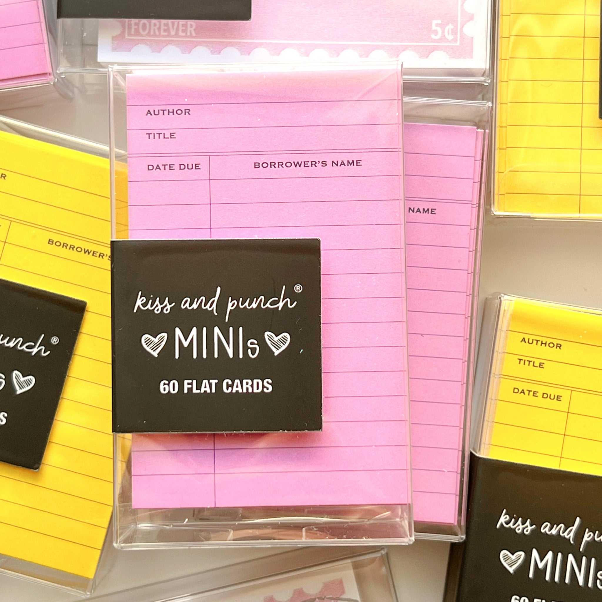 Kiss and Punch Mini flat cards packaging with pink and yellow cards.